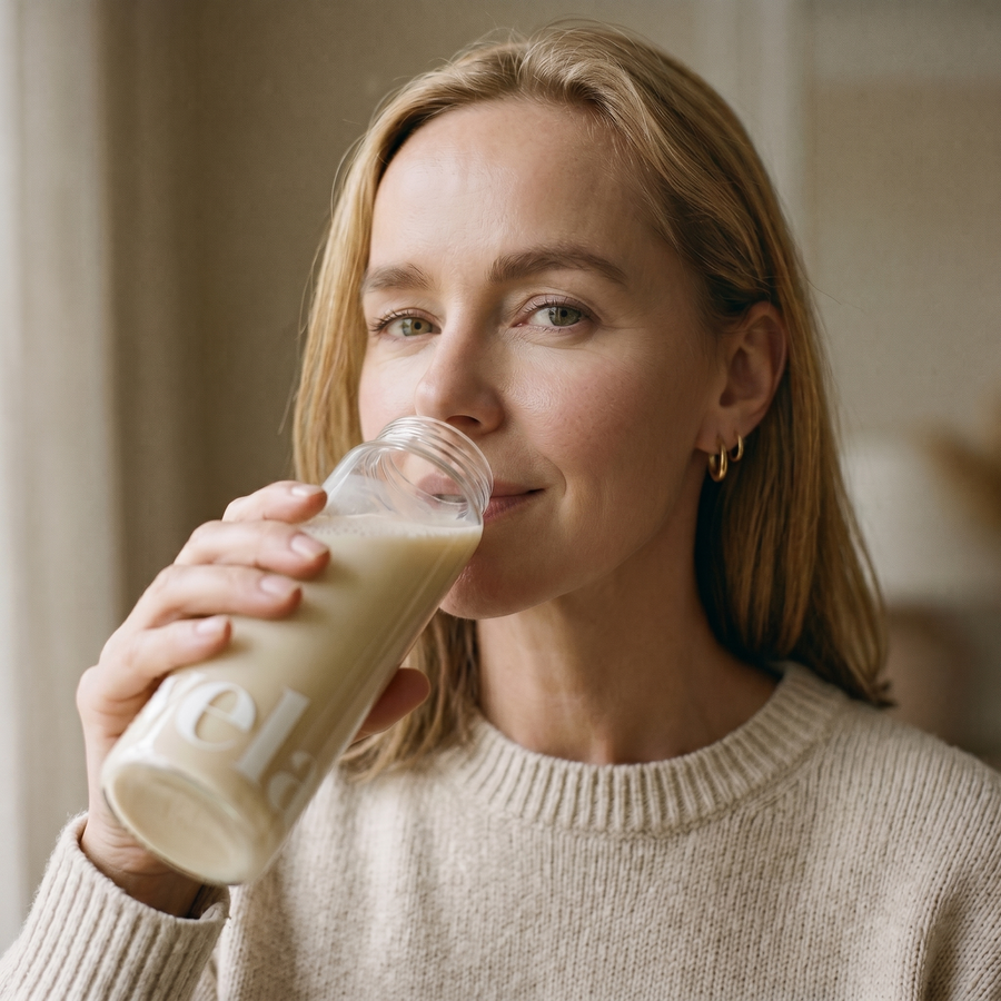 Frau mit Vela Drink